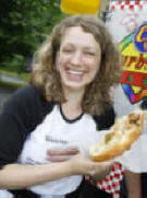 Munchmobile's Monica Buonincontri Eating Curbside Cafe's " Famous Double Italian Hot Dog" - (Photo by Tim Farrell/The Star-Ledger) 